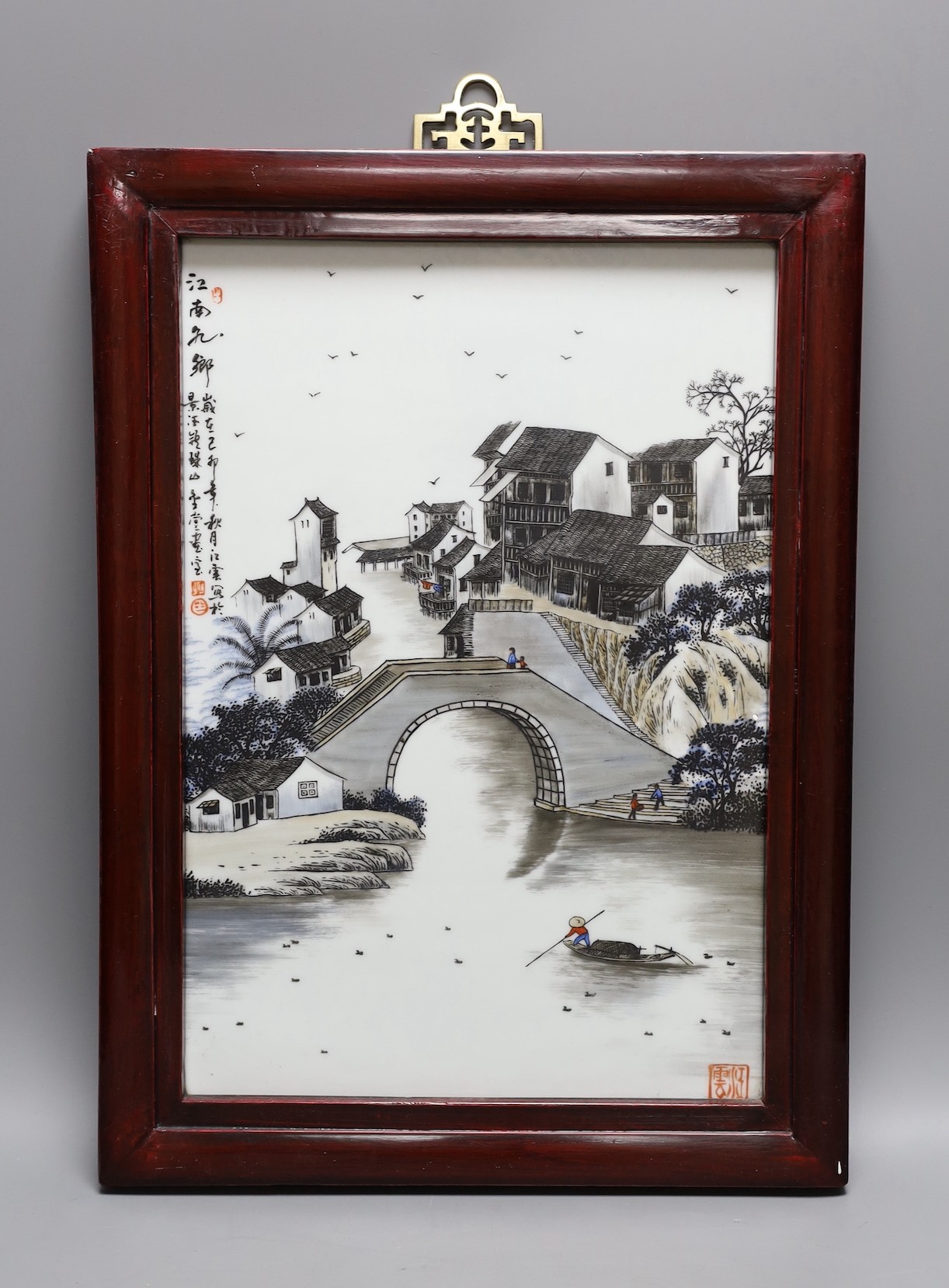 A Chinese porcelain plaque, decorated with a river scene, 34x23cm excl frame